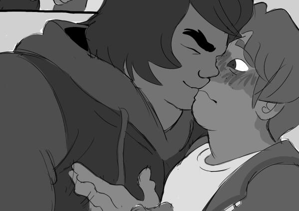 Cole and Jay from LEGO NINJAGO sharing a kiss. Jay looks surprised and flustered.